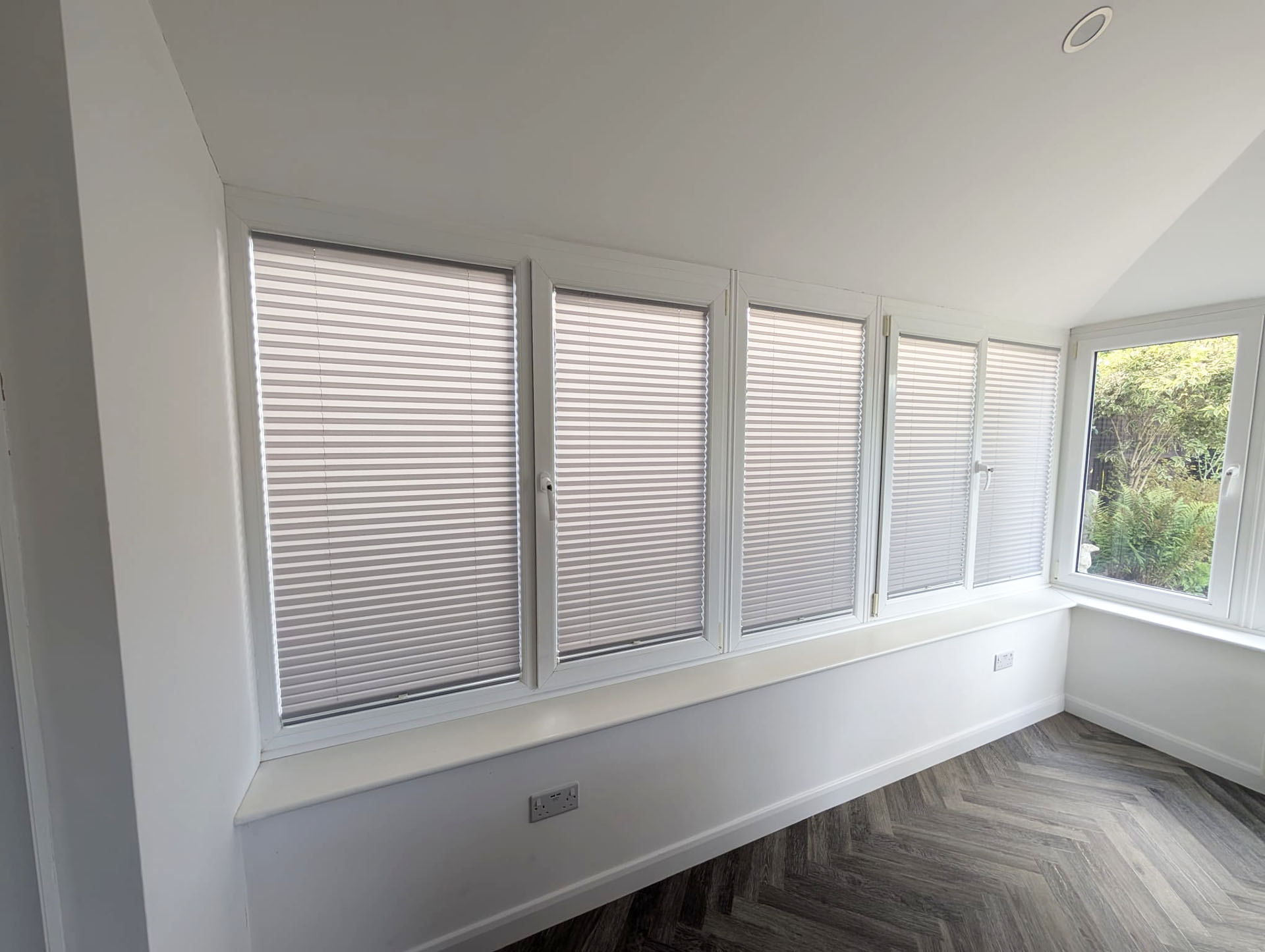 Local Blinds Transformations - Recent Projects in Northamptonshire image shows a conservatory fitted with new pleated blinds