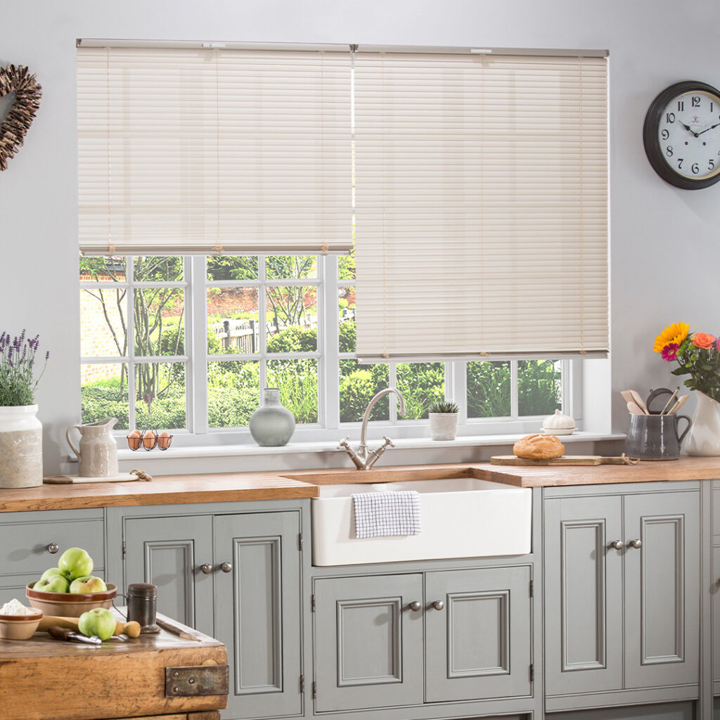 Durable Blinds That Survive Real Life - this image shows metal venetian blinds in a kitchen setting
