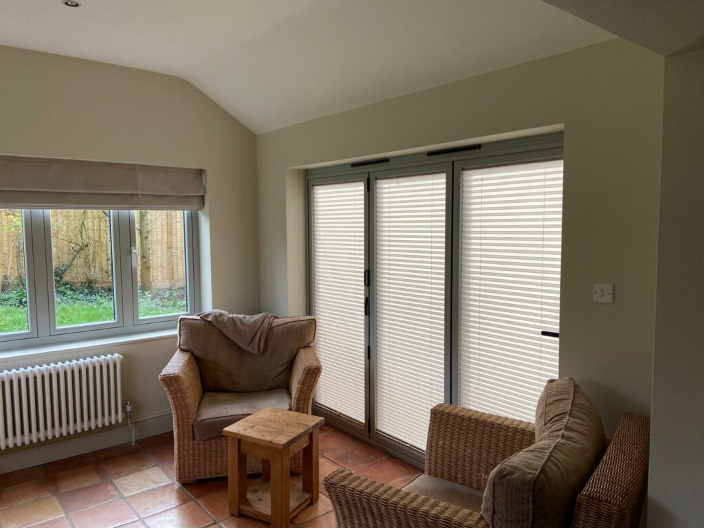 Pleated blinds installed on patio doors in Bugbrooke living space Northamptonshire