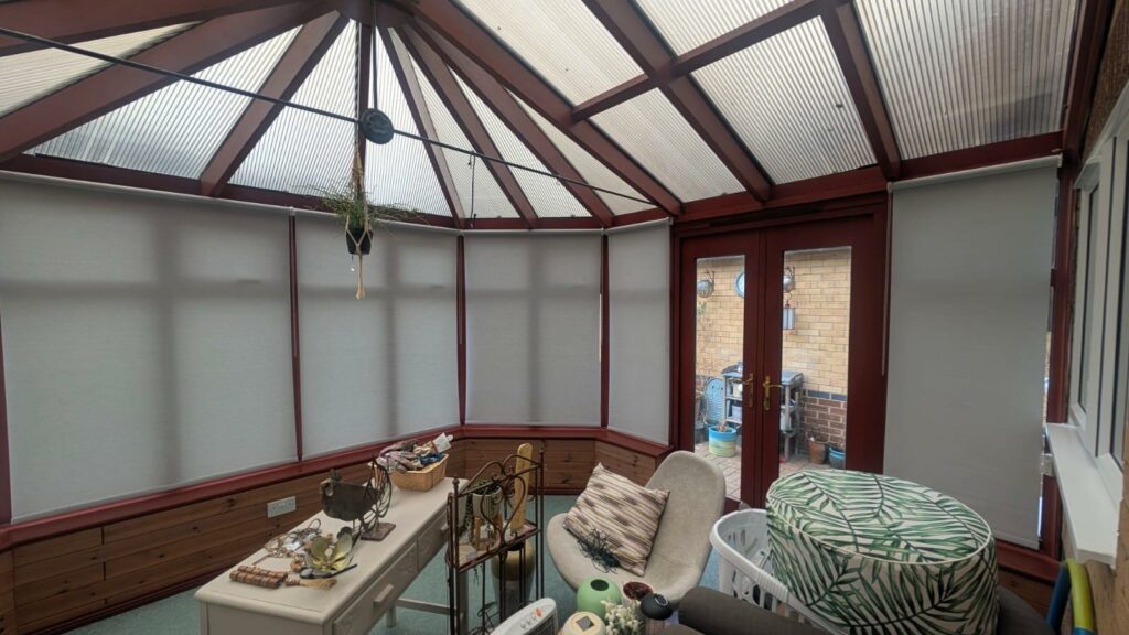 Conservatory blinds installed in Duston Northampton covering multiple window panels to improve light control and privacy