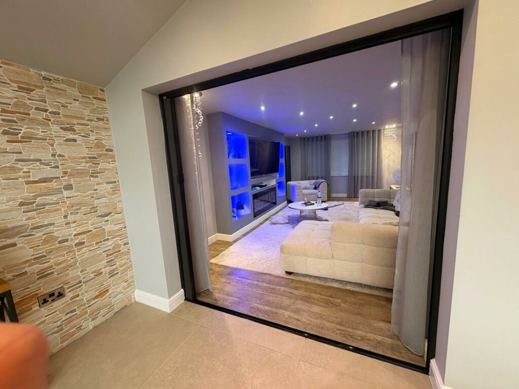 Blind Screen fully open between two open-plan living spaces
