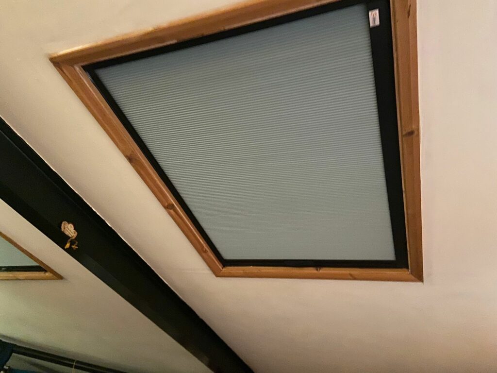 Blind Screen covering a large skylight in a Welford home