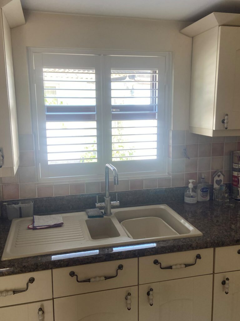 Kitchen shutters with adjustable louvres providing privacy and light control