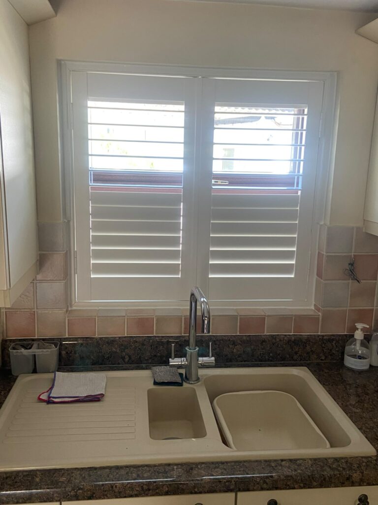 4. Kitchen shutters with adjustable louvres partially open for natural light