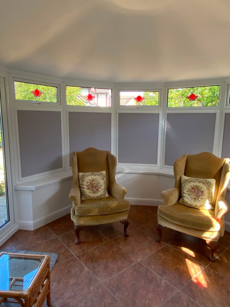 Grey INTU pleated blinds fitted to individual conservatory windows in Northampton