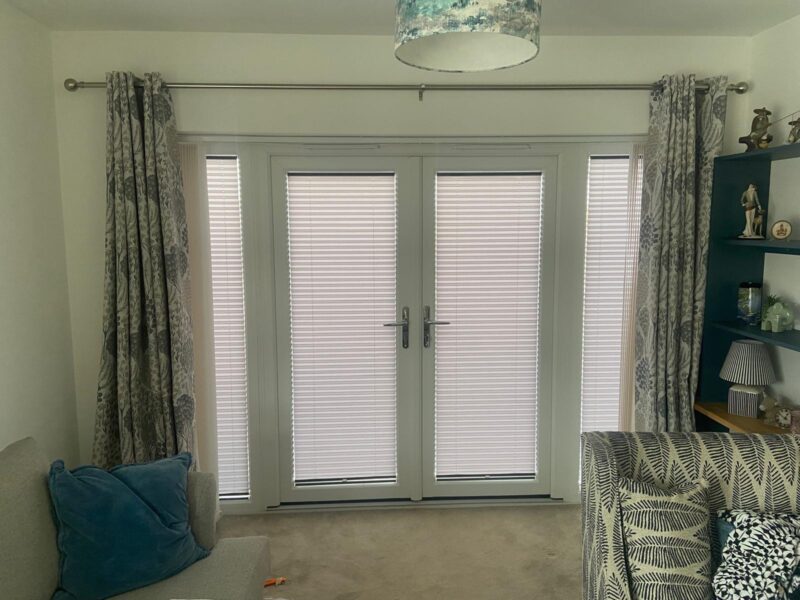 Pleated blinds fitted to double garden doors and narrow side panels in Wellingborough