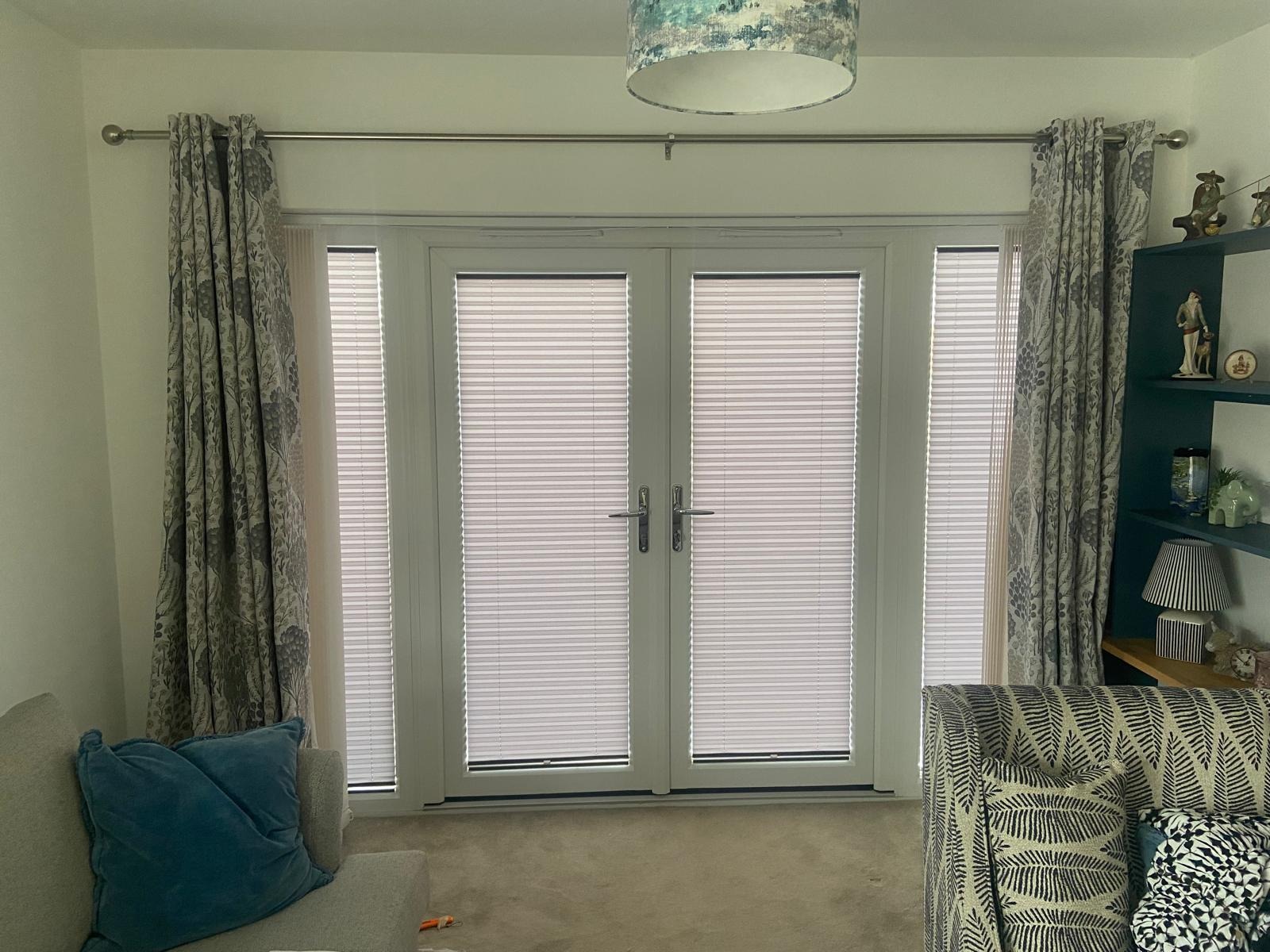 Pleated blinds fitted to double garden doors and narrow side panels in Wellingborough