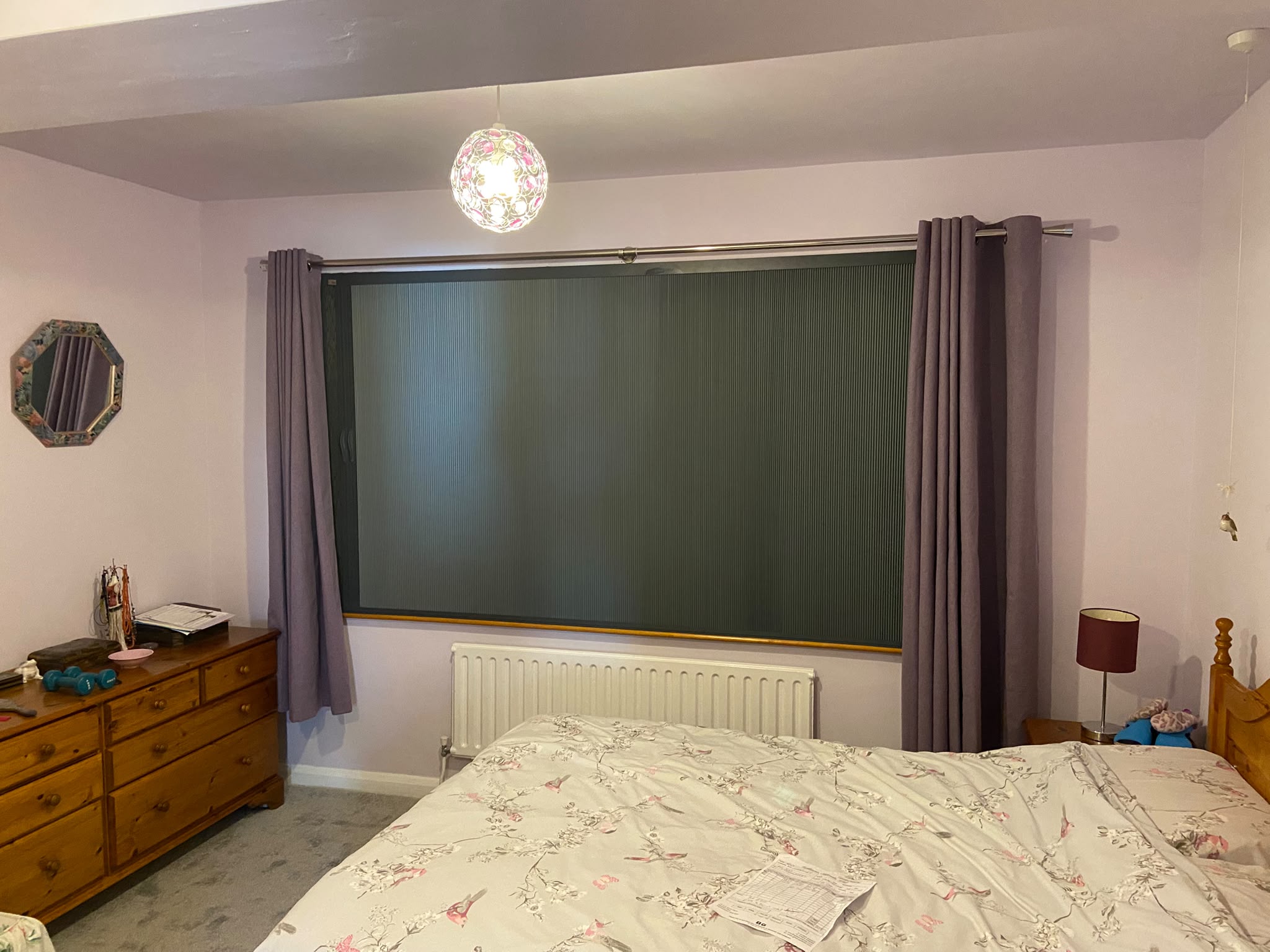 Fully drawn pleated Blind Screen covering a bedroom window, fitted outside the recess in Northampton