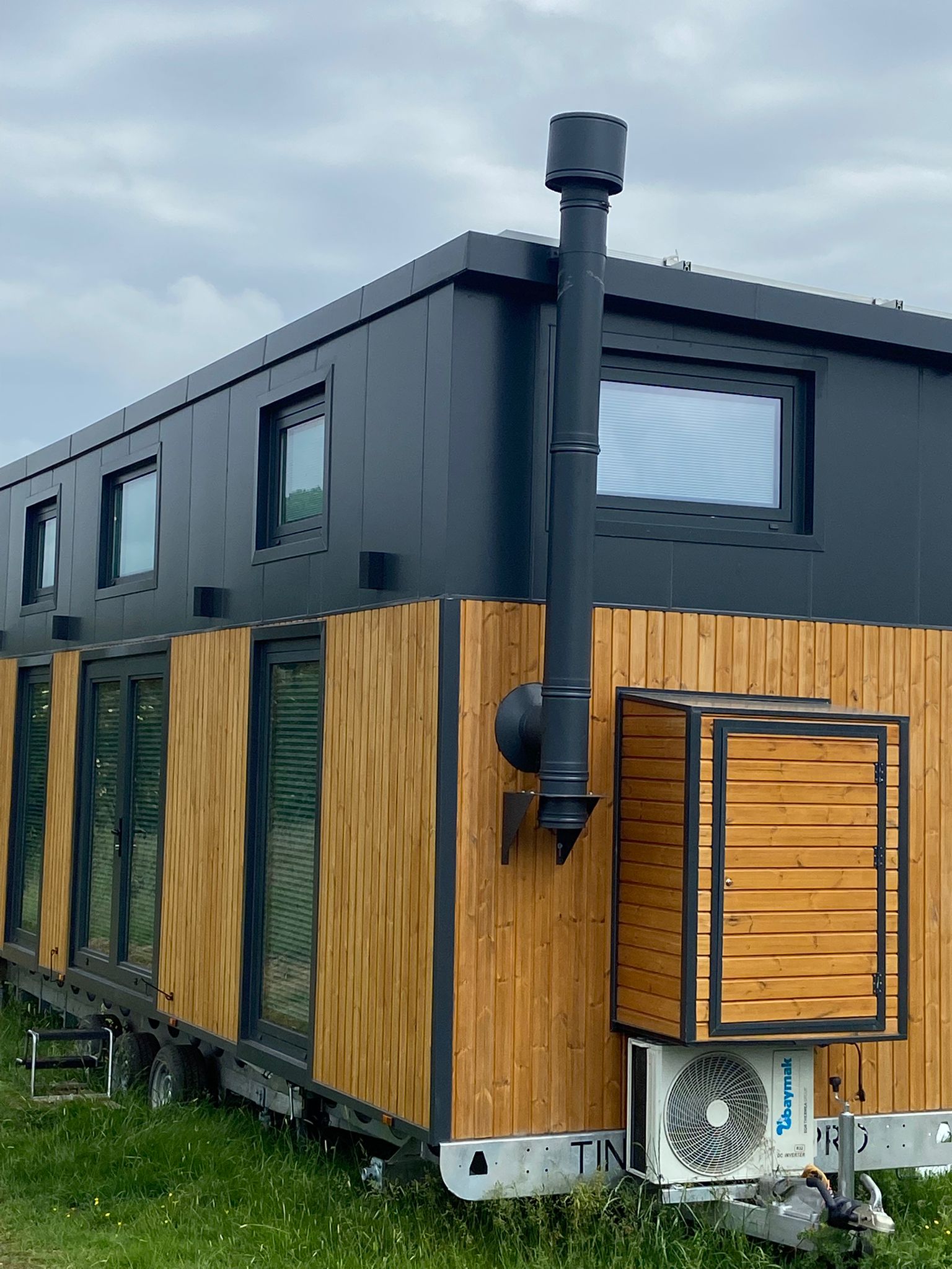Exterior of trailer conversion with made-to-measure window blinds in Weedon